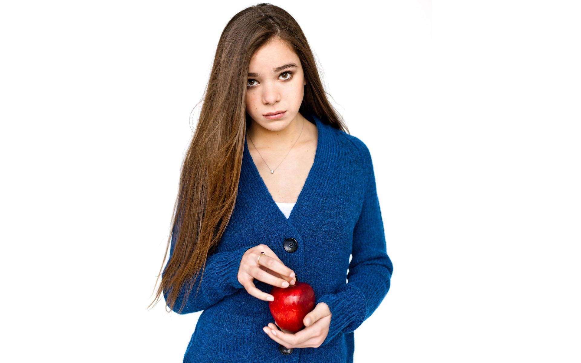girl holding red apple