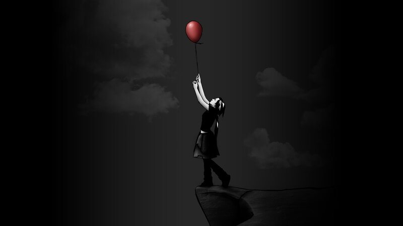 Girl holding red balloon