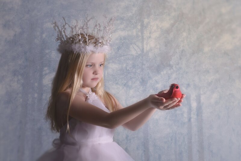 Girl Holding Red Bird