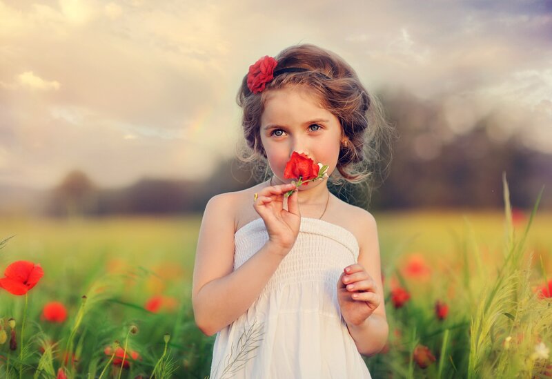 Girl Holding Red Flower — Serene