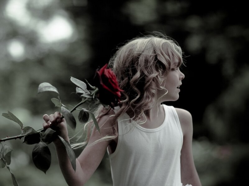 Girl Holding Red Rose — Dramatic