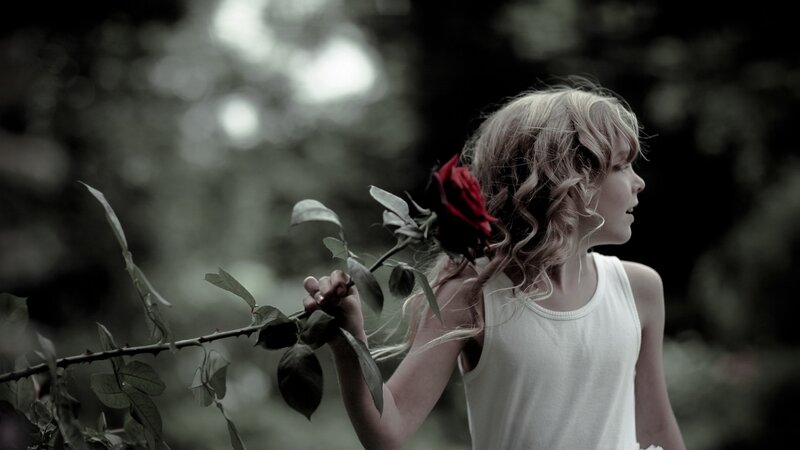 girl holding red rose