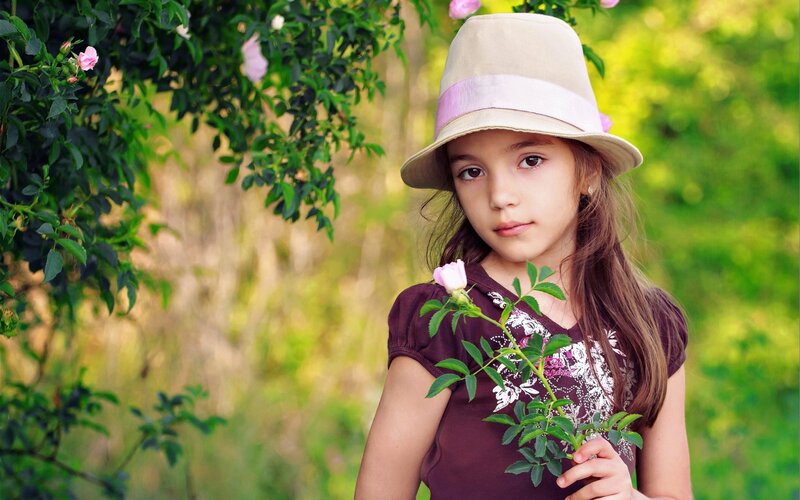 Girl Holding Rosebud