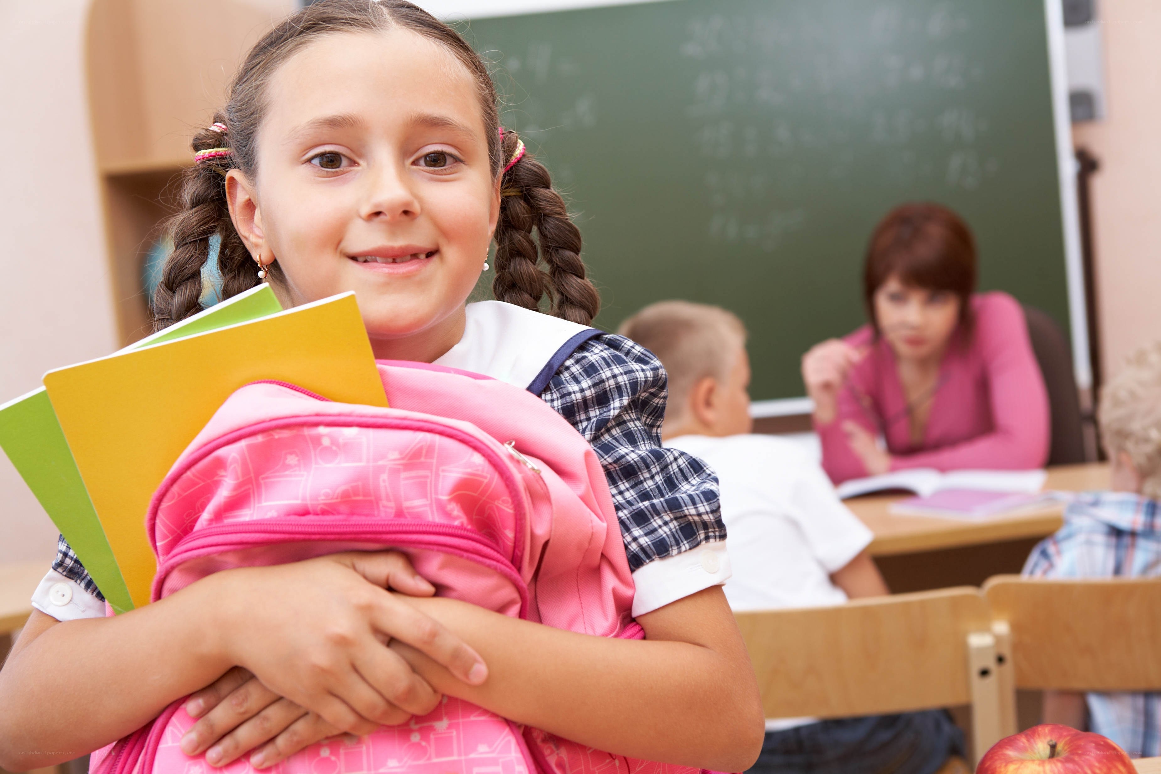 Girl holding school books