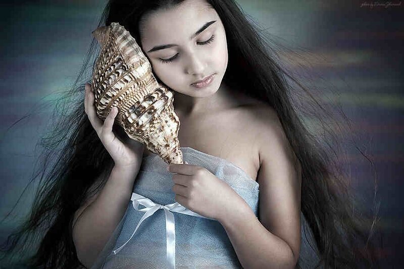 Girl Holding Seashell