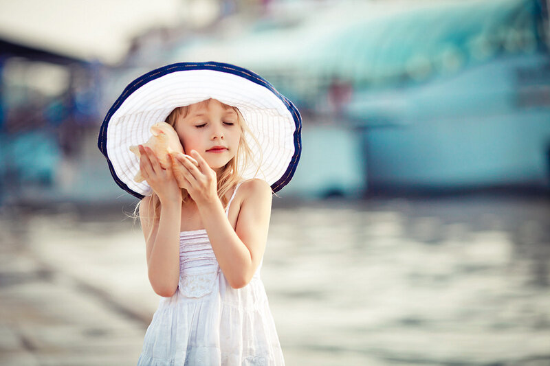 Girl Holding Seashell — White