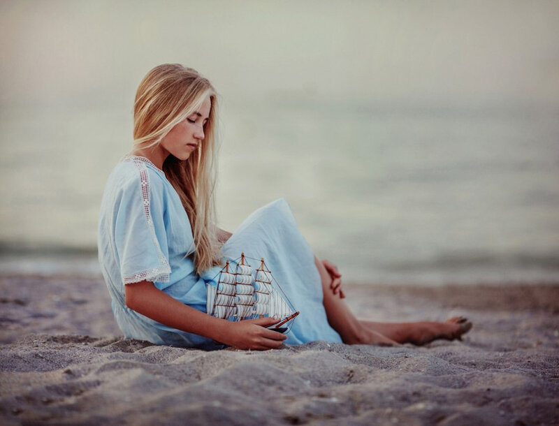 Girl Holding Ship Model