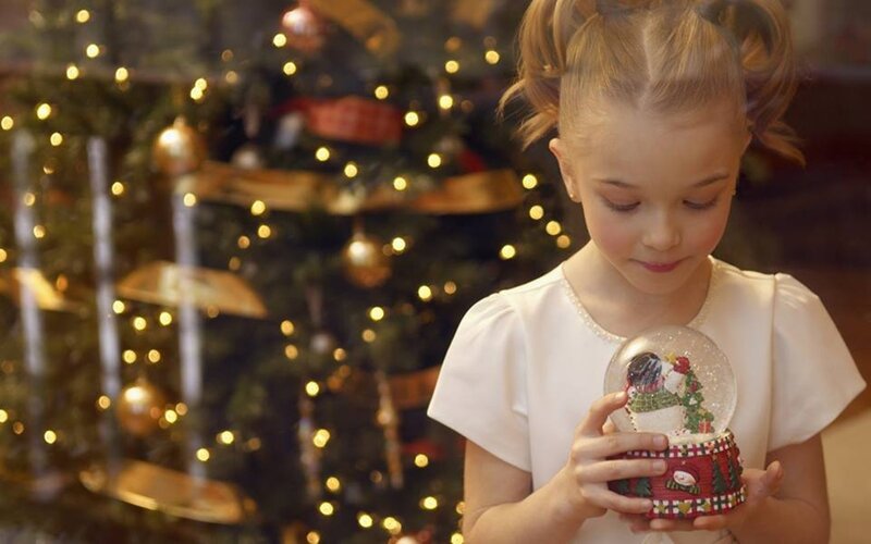 Girl Holding Snow Globe — White