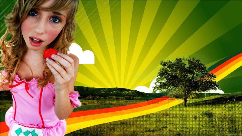 girl holding strawberry in field