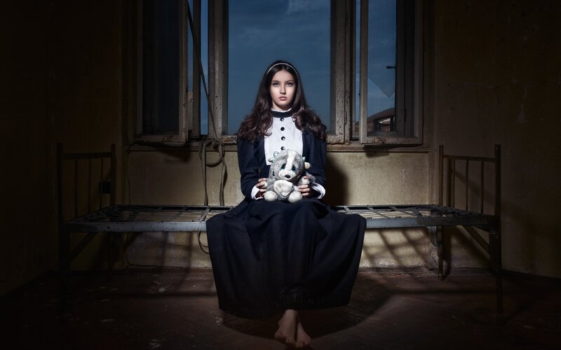 Girl Holding Stuffed Animal — Black