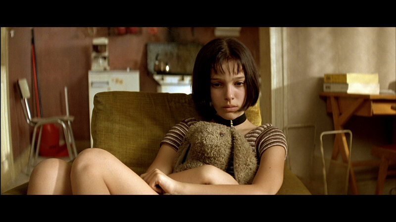 Girl Holding Stuffed Animal — Brown