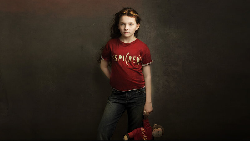 Girl Holding Stuffed Monkey