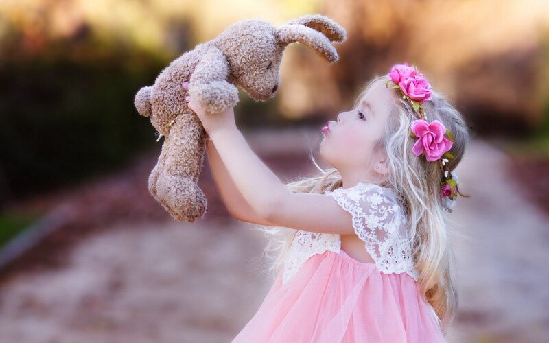 Girl Holding Stuffed Rabbit — Pink
