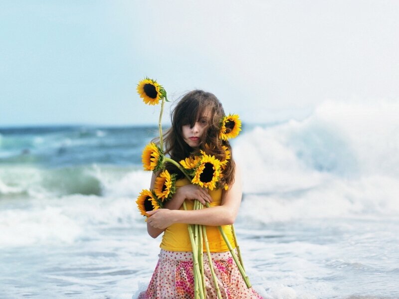 Girl Holding Sunflowers — Yellow, Calm