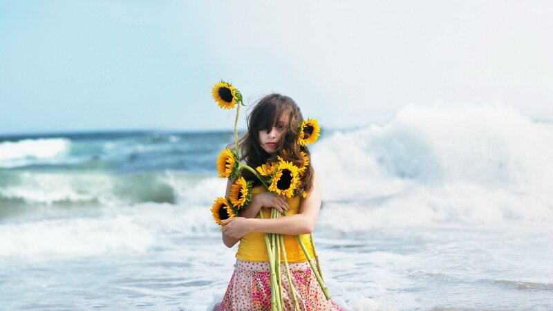 Girl Holding Sunflowers — Yellow, Serene, Afternoon