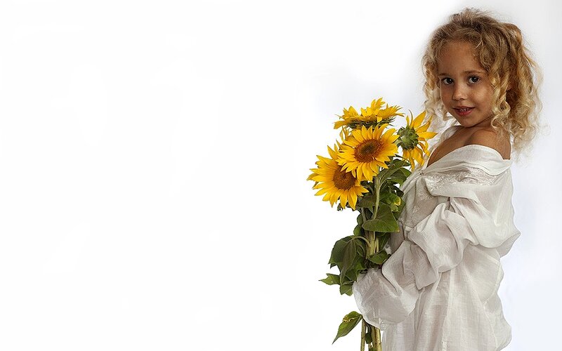 Girl Holding Sunflowers — Yellow