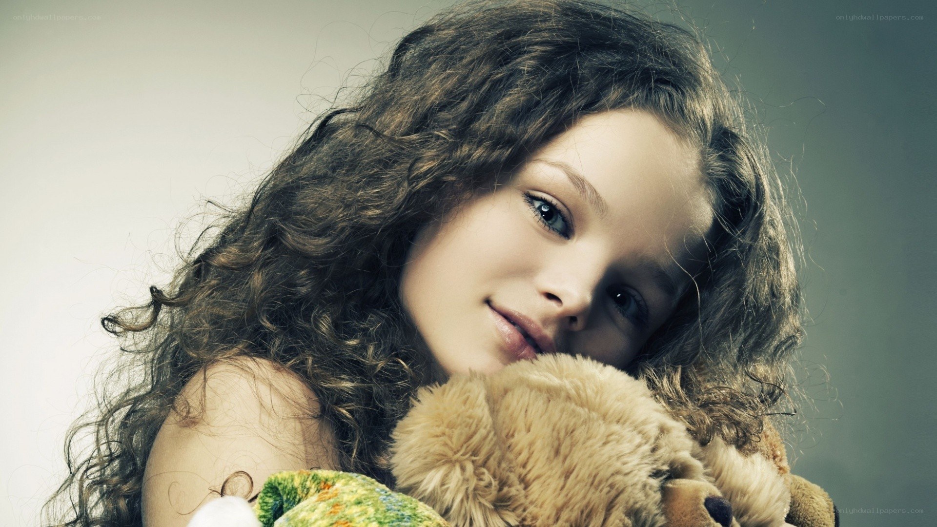 girl holding teddy bear