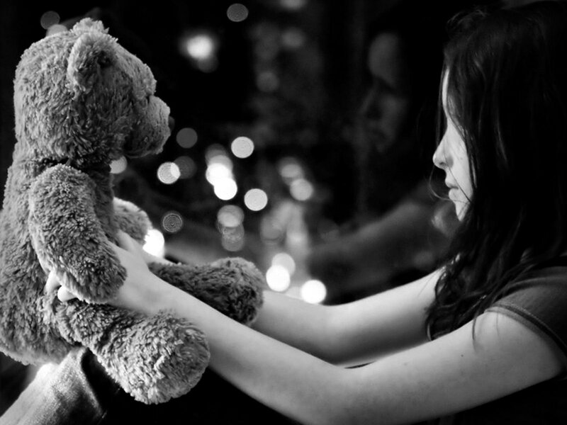 Girl Holding Teddy Bear — Black, Melancholic