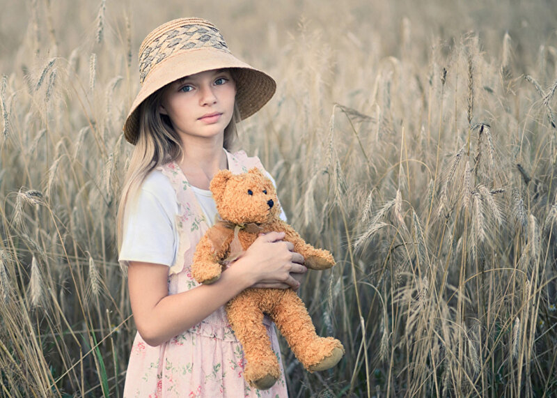 Girl Holding Teddy Bear — Brown, Serene