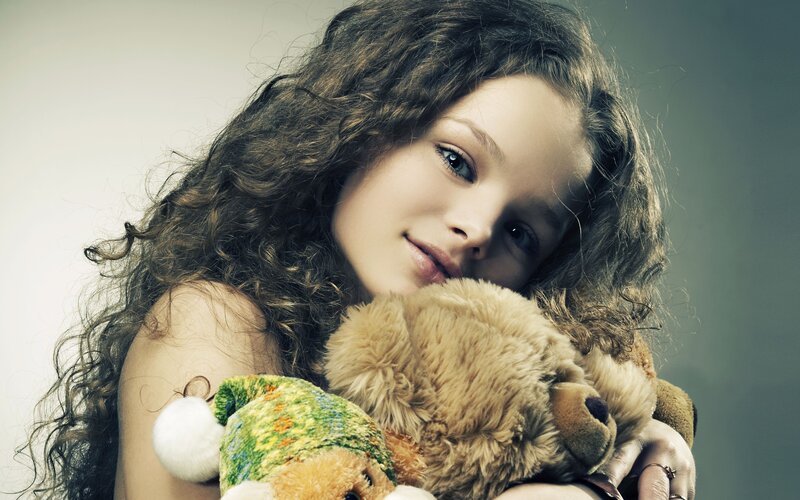 Girl Holding Teddy Bear — Brown