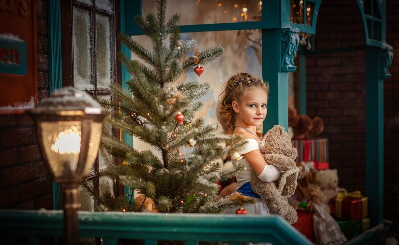 Girl Holding Teddy Bear — Green, Festive, Winter