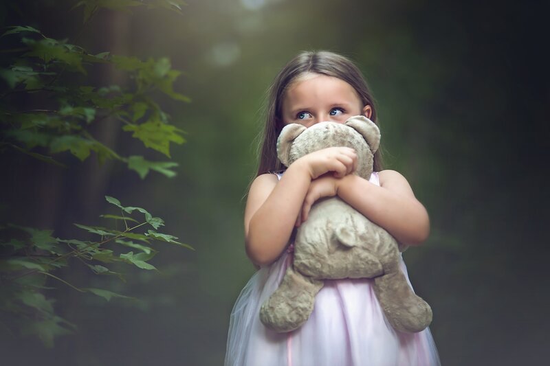 Girl Holding Teddy Bear — Green, Serene, Photograph