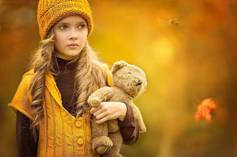 Girl Holding Teddy Bear — Yellow, Calm