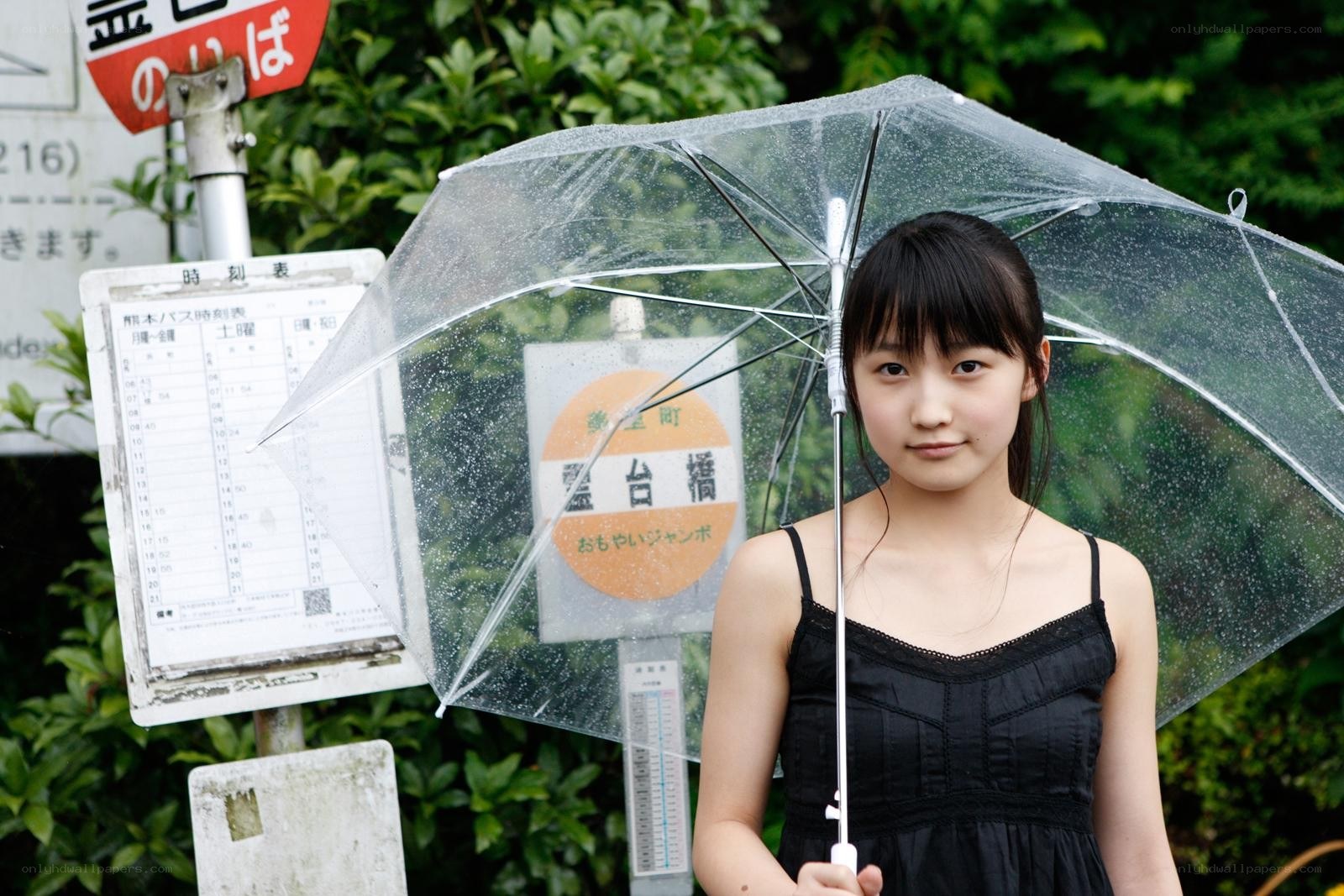 Girl holding transparent umbrella