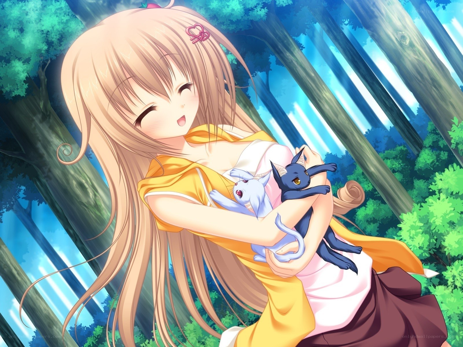 girl holding two cats in forest