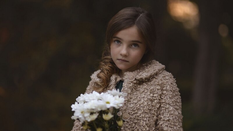 Girl Holding White Flowers — Brown