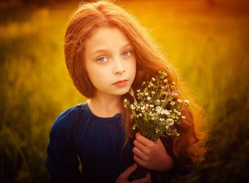 Girl Holding Wildflowers — Golden