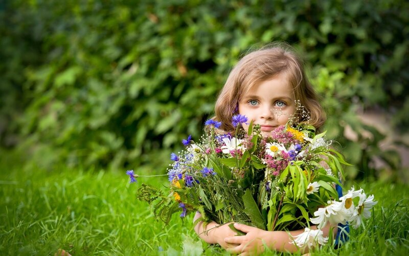 Girl Holding Wildflowers — Green