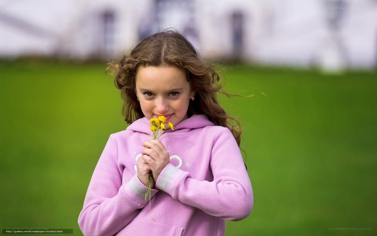 girl holding yellow flowers