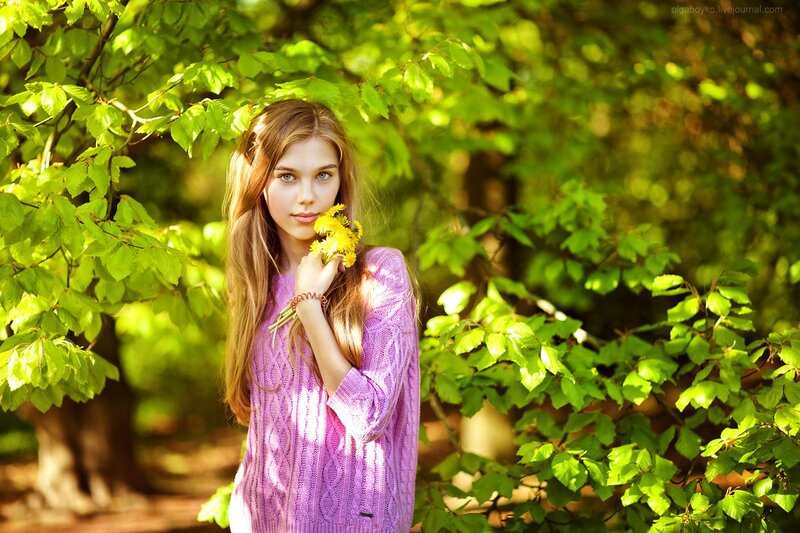 Girl Holding Yellow Flowers — Green
