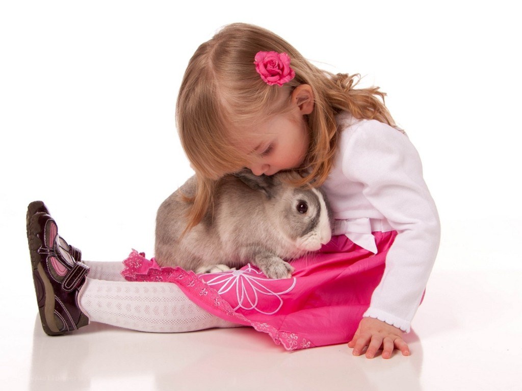 girl hugging a rabbit