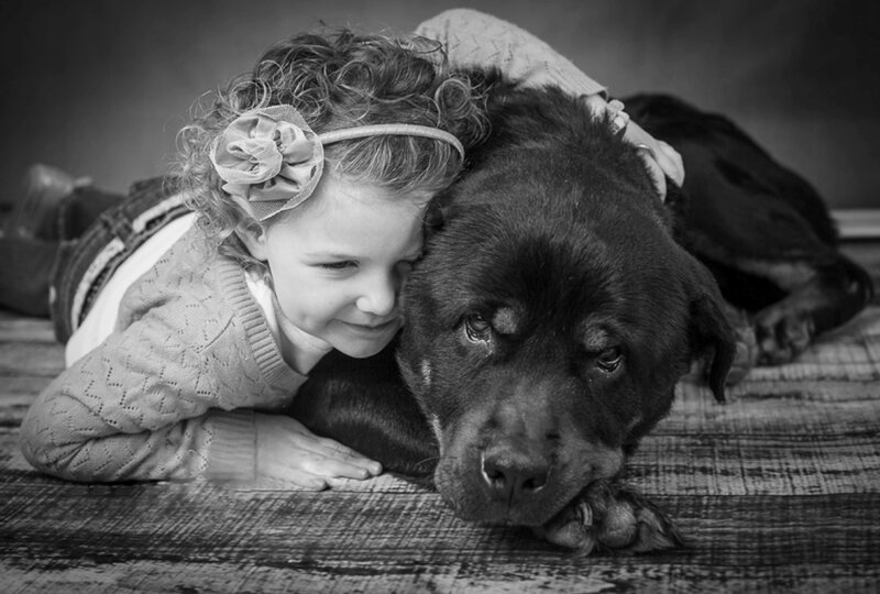 Girl Hugging Dog — Black, Calm