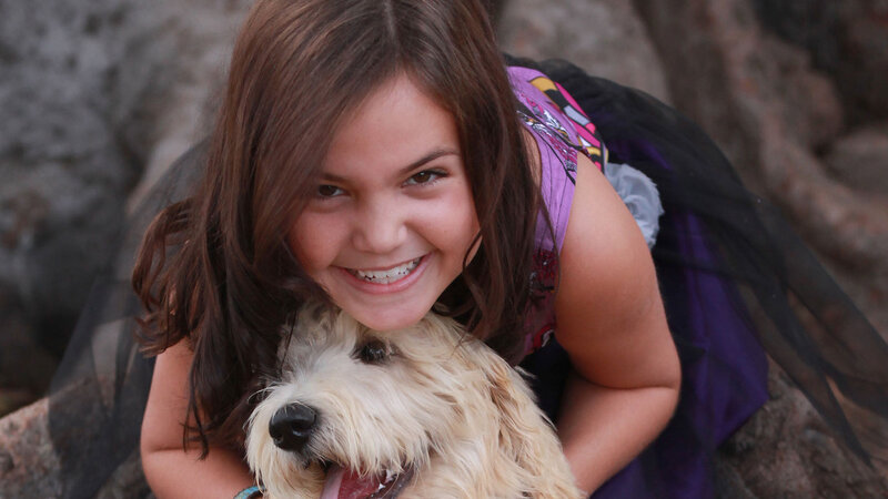 Girl Hugging Dog — Brown, Happy