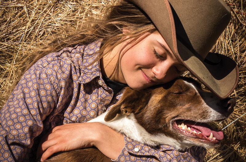 Girl Hugging Dog — Brown, Peaceful