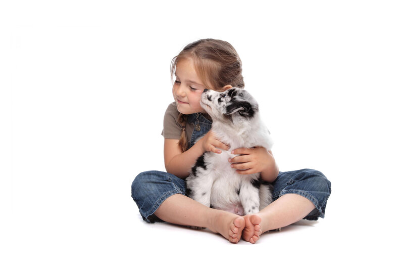 Girl Hugging Puppy