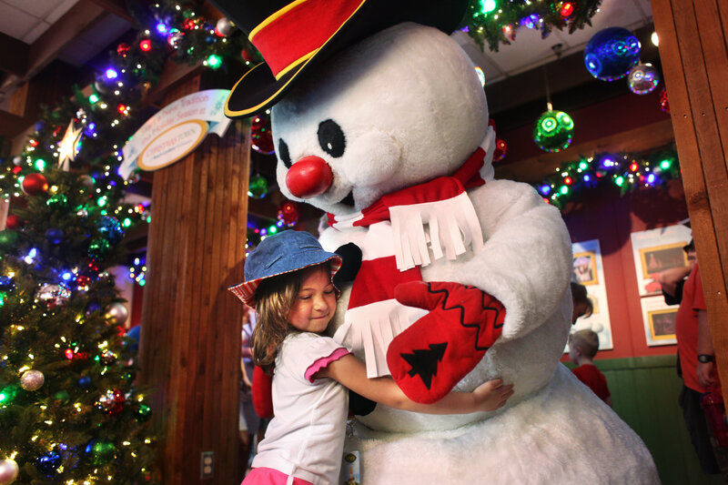 Girl Hugging Snowman