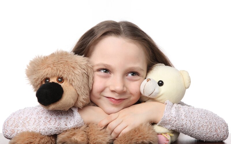 Girl Hugging Stuffed Animals — White