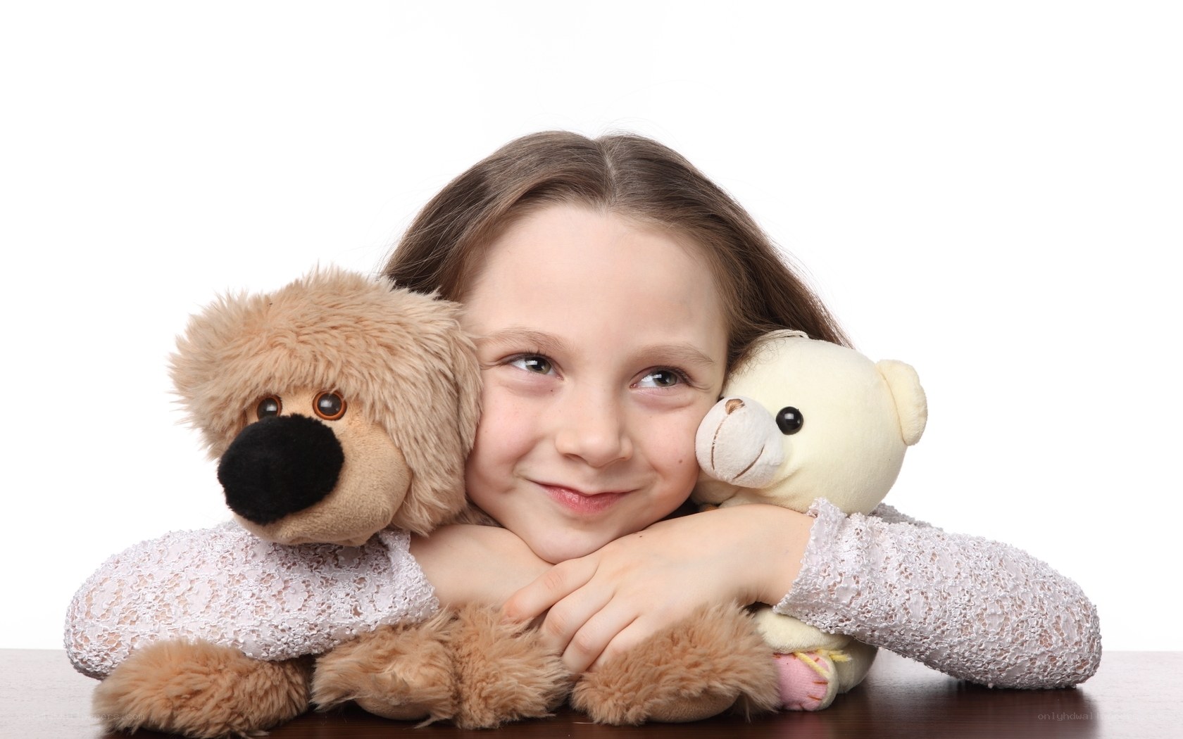 girl hugging stuffed animals