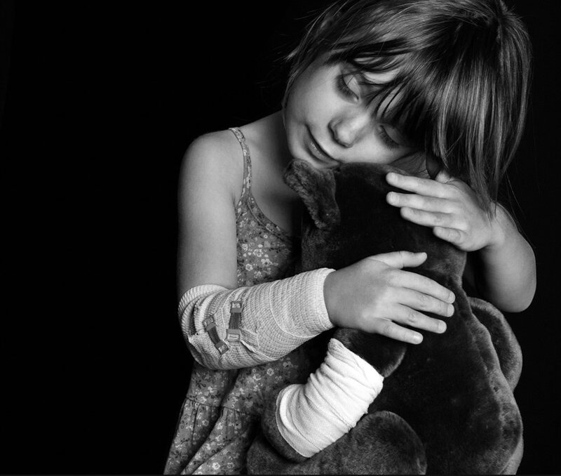 Girl Hugging Stuffed Bear