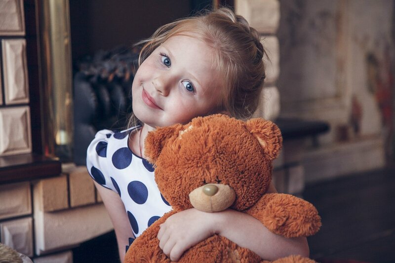 Girl Hugging Teddy Bear — Brown, Calm