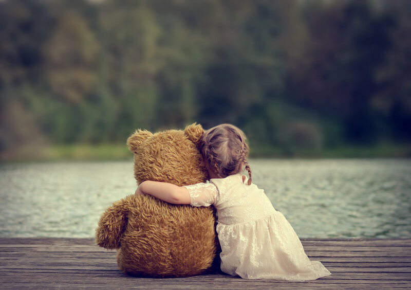 Girl Hugging Teddy Bear — Brown, Serene