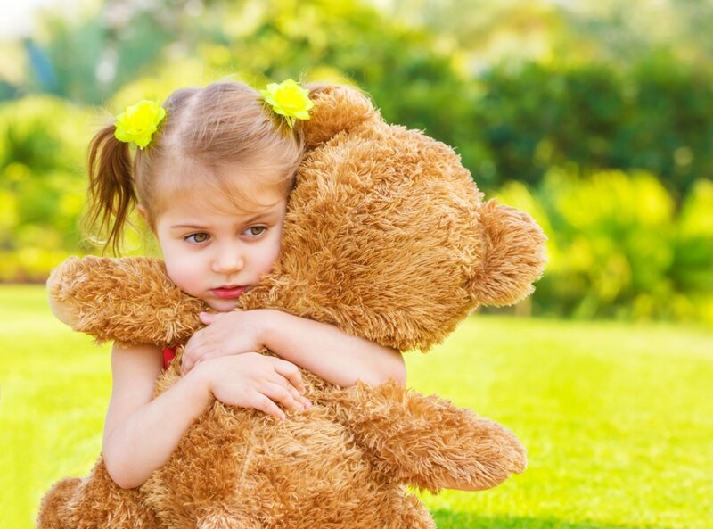 Girl Hugging Teddy Bear — Green, Peaceful