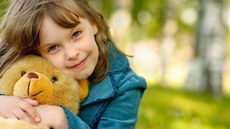 Girl Hugging Teddy Bear — Green
