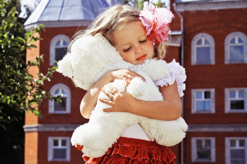 Girl Hugging Teddy Bear — White, Peaceful