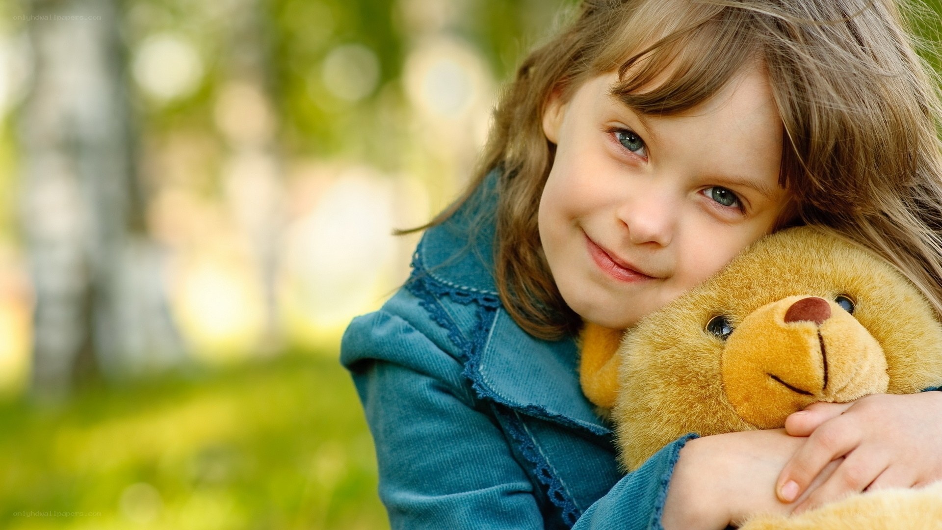 girl hugging teddy bear