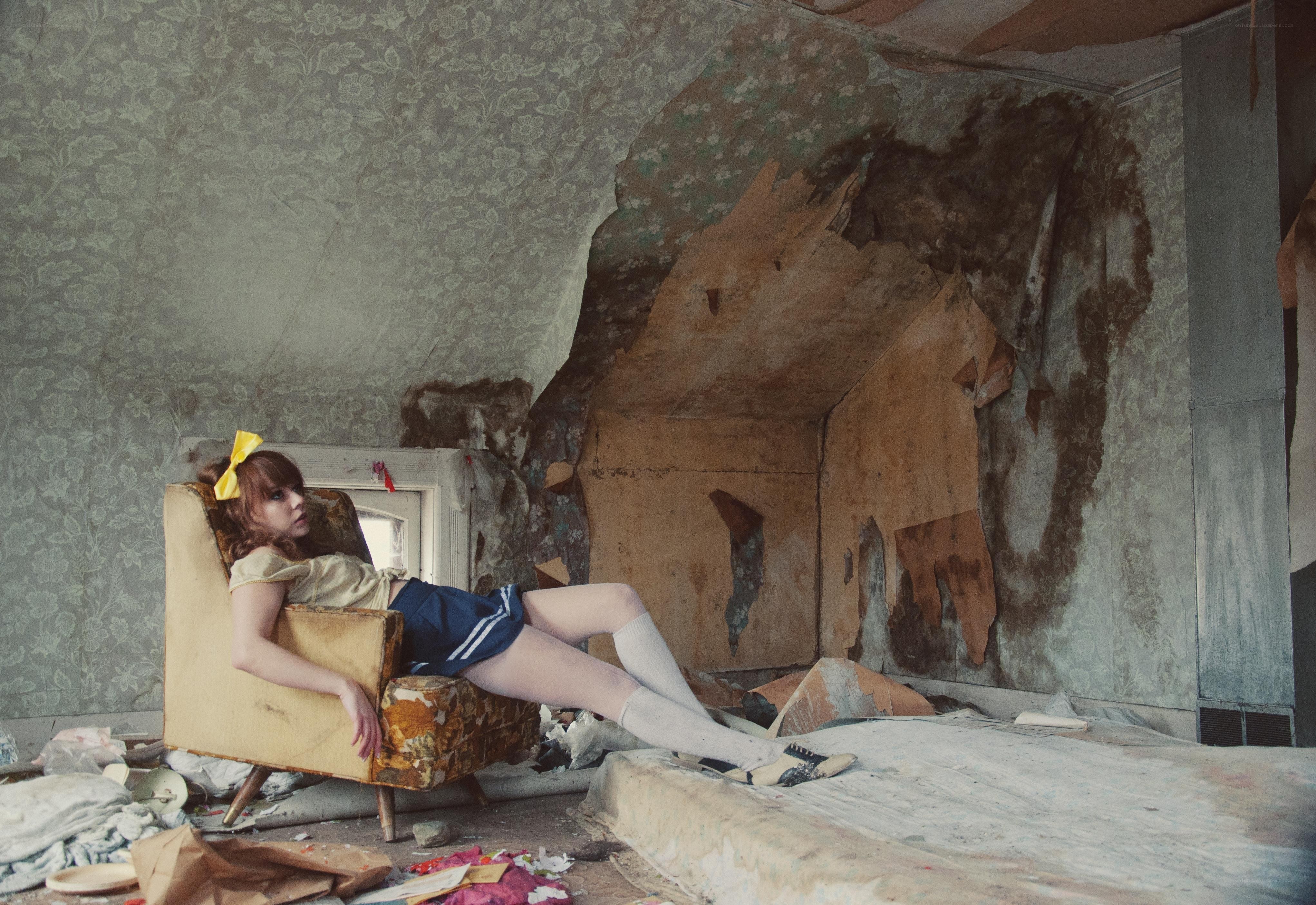 Girl in a dilapidated room